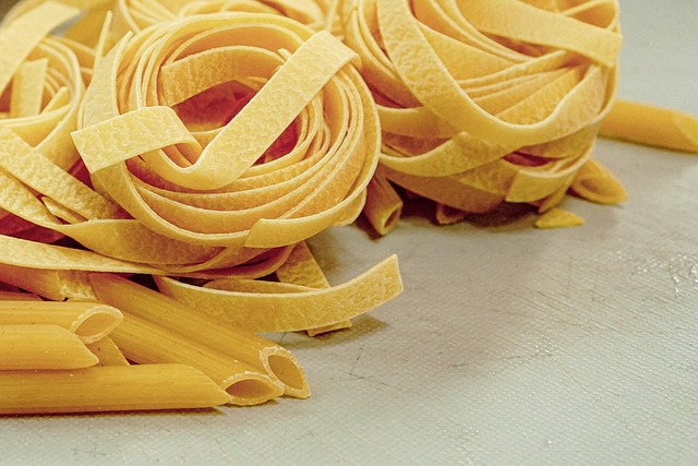 gourmet dish close-up with truffle shavings on pasta in dark setting with gold accents
